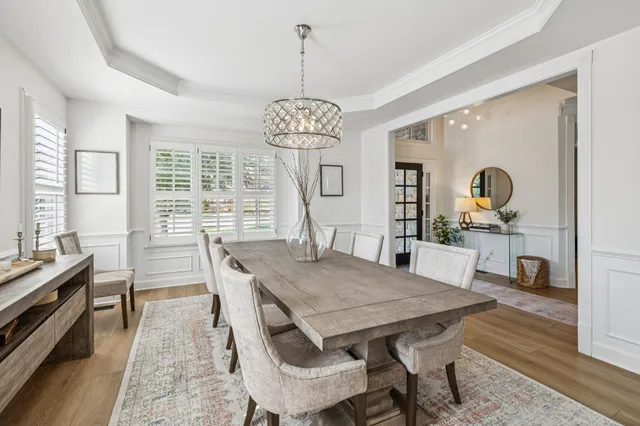 a large kitchen with a table and chairs