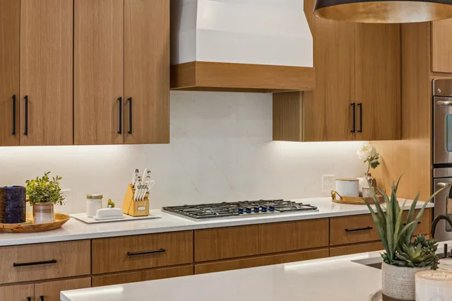 a view of a kitchen with refrigerator and a refrigerator