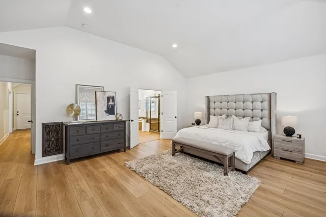 a view of a patio with couches table and chairs and potted plants