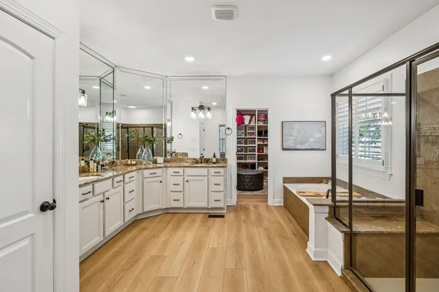 a view of a house with a big yard potted plants and a big yard