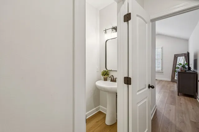 a front view of a house with a iron gate