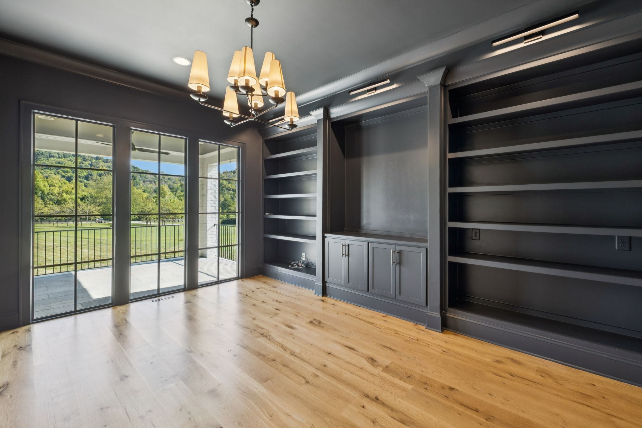 2245 Skinner Road Arrington, TN 37014 - Photo 20 of 98 a view of an empty room with a window and wooden floor