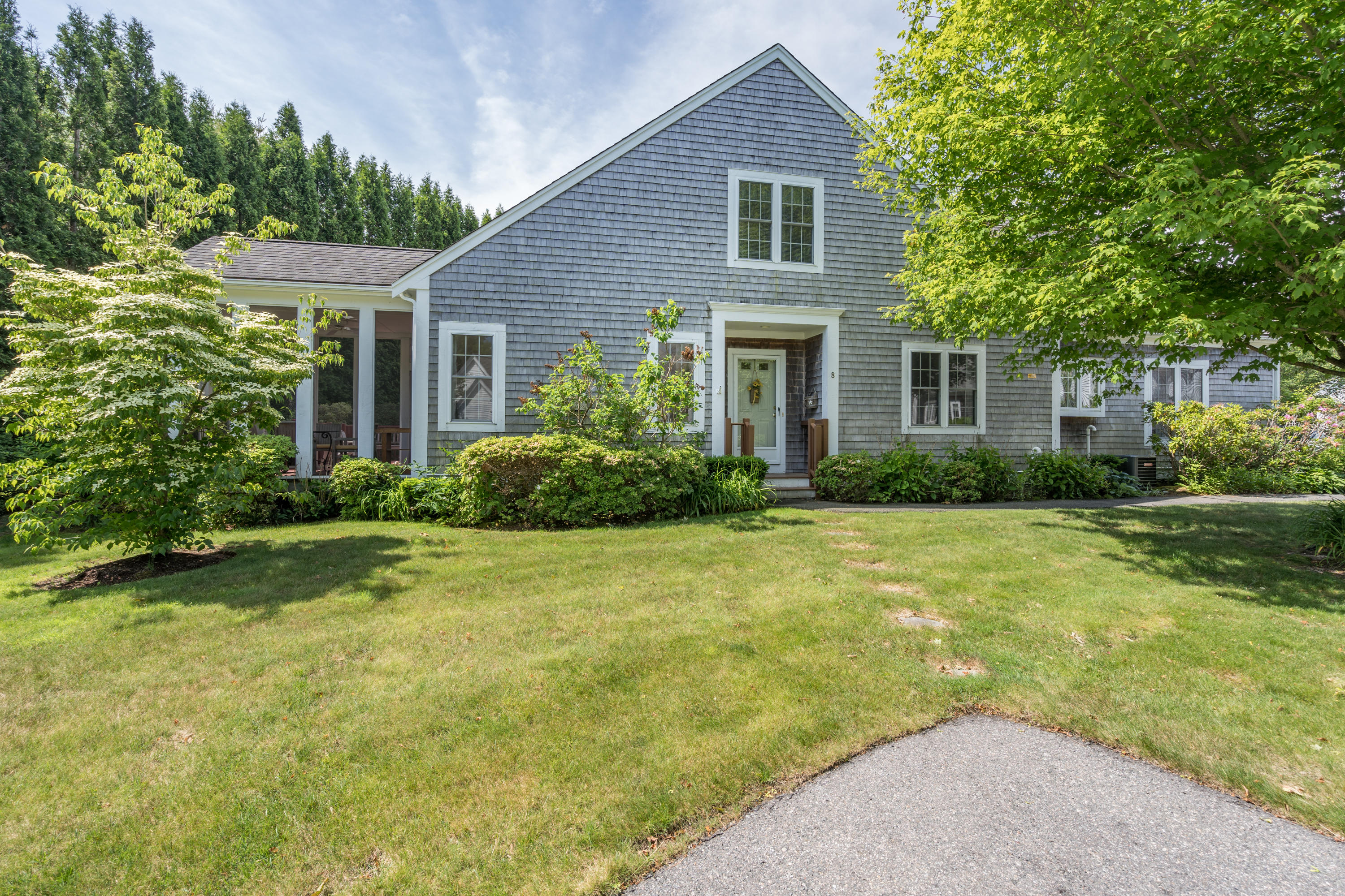 8 Stratford Ridge Mashpee, MA 02649 - Photo 1 of 23 a front view of house with yard and green space