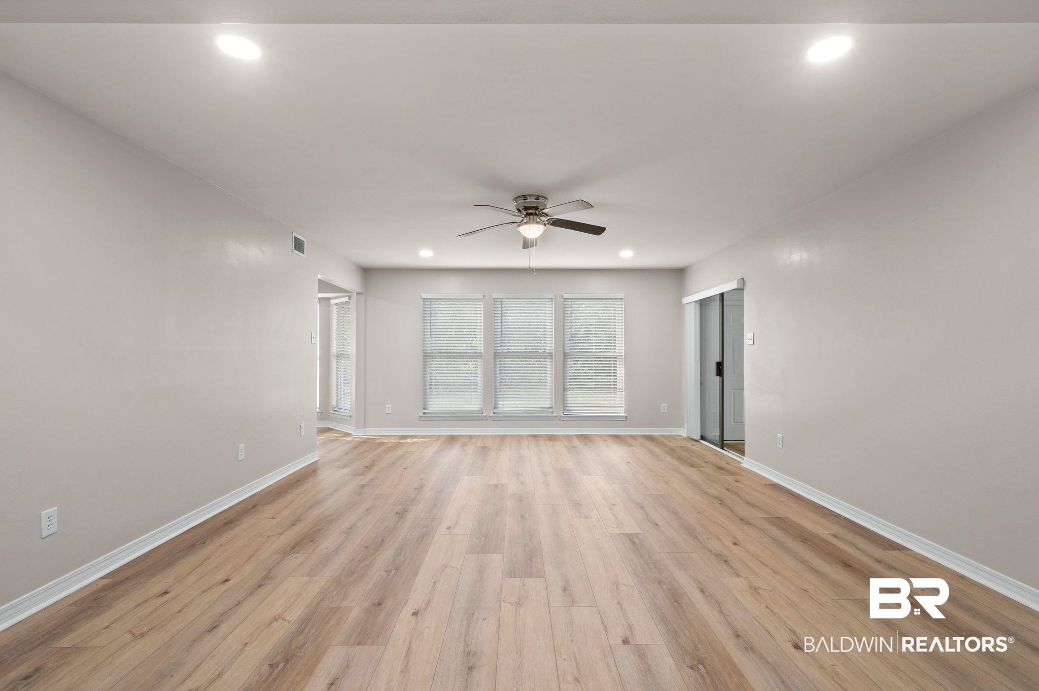 105 South Windgate Circle Daphne, AL 36526 - Photo 5 of 37 Unfurnished living room with light wood finished floors, baseboards, recessed lighting, and a ceiling fan