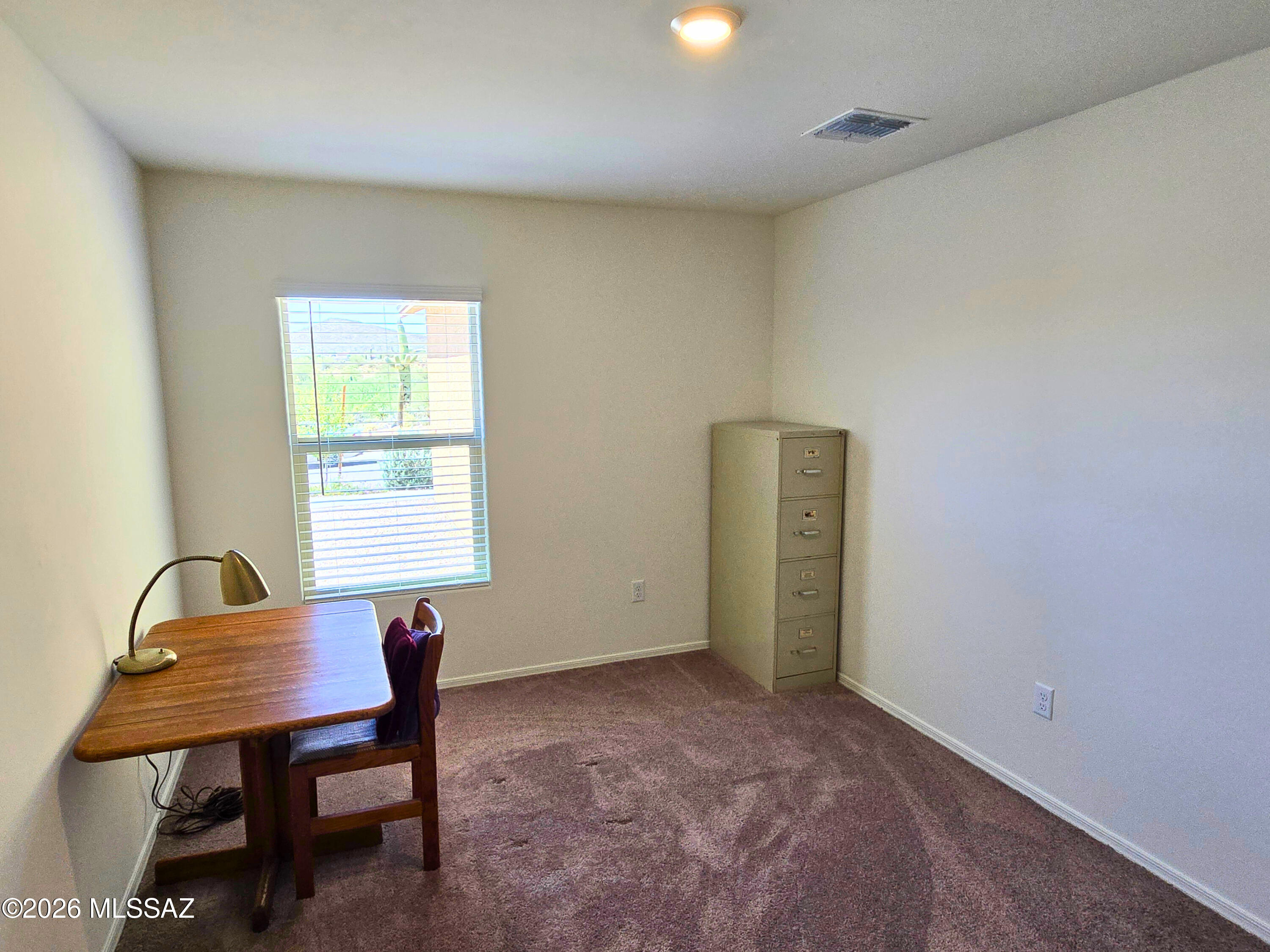 6343 South Rigby Way Tucson, AZ 85746 - Photo 14 of 29 a view of a workspace with furniture and a window
