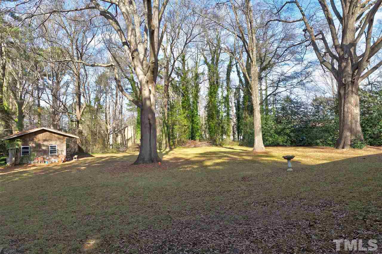 6015 Inona Place Raleigh, NC 27606 - Photo 22 of 25 a view of large trees with yard