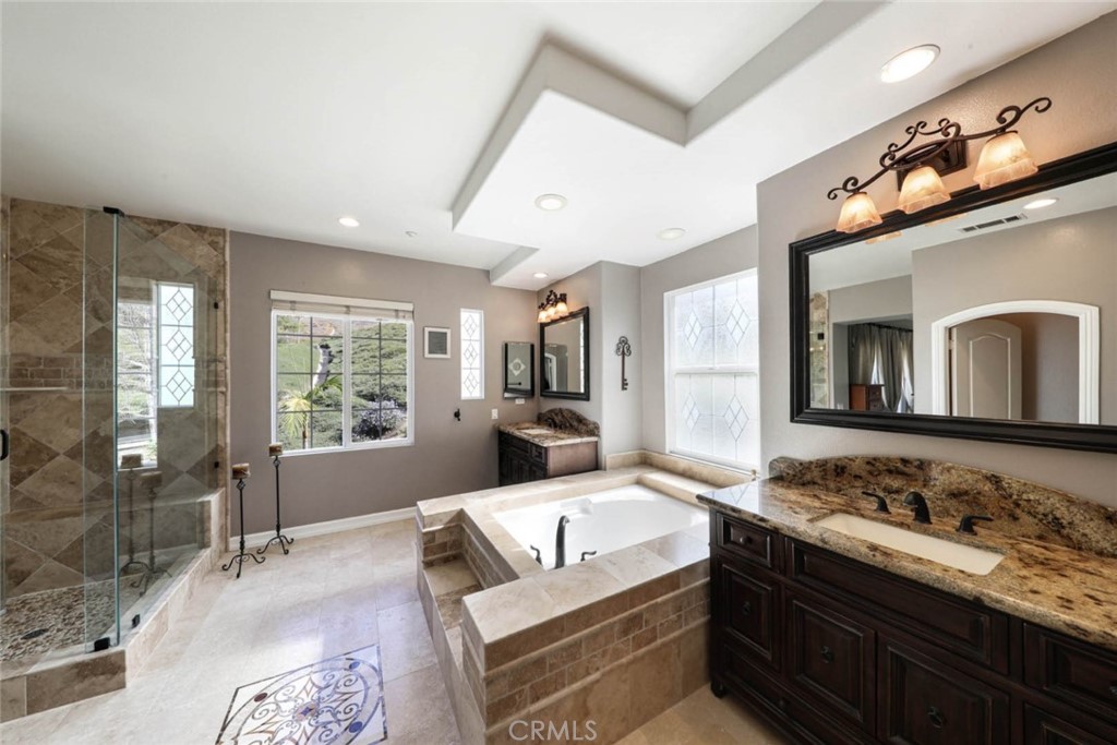 6402 Camino Ventosa San Clemente, CA 92673 - Photo 25 of 67 a living room with granite countertop furniture a fireplace and a flat screen tv