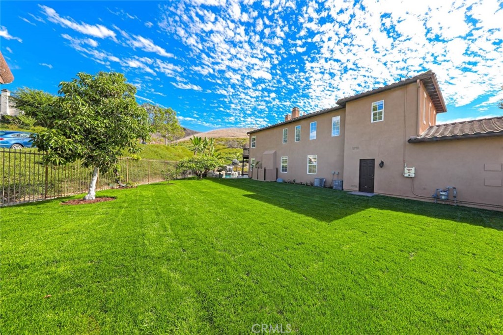 6402 Camino Ventosa San Clemente, CA 92673 - Photo 3 of 67 a backyard of a house with plants and large tree