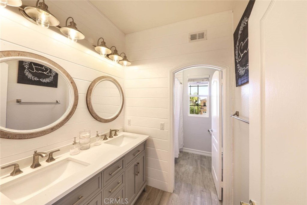 6402 Camino Ventosa San Clemente, CA 92673 - Photo 31 of 67 a bathroom with a sink and a mirror