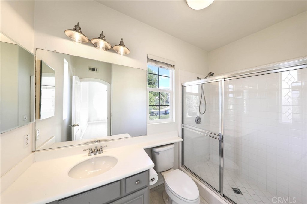 6402 Camino Ventosa San Clemente, CA 92673 - Photo 33 of 67 a bathroom with a sink toilet and shower