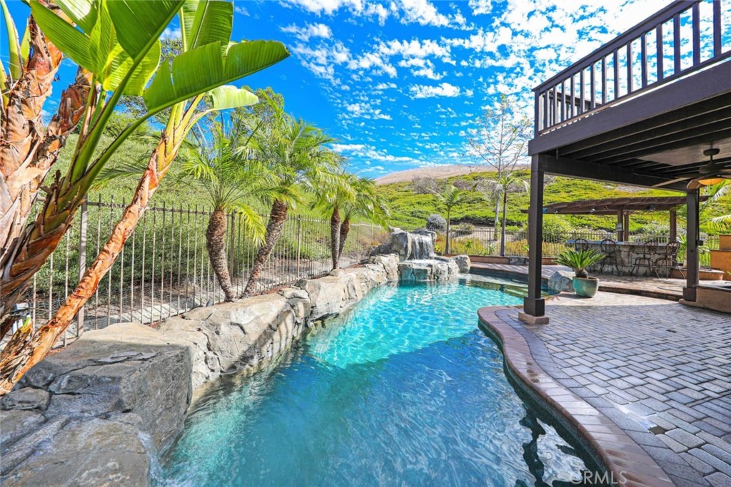 6402 Camino Ventosa San Clemente, CA 92673 - Photo 37 of 67 a view of a patio with table and chairs potted plants with wooden floor