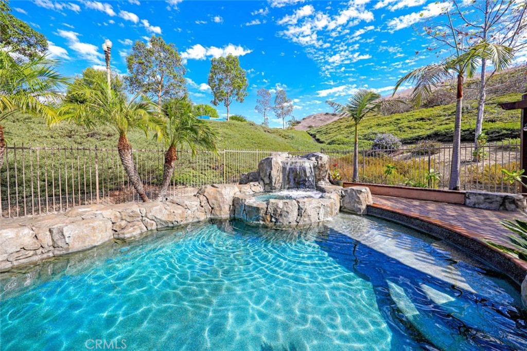 6402 Camino Ventosa San Clemente, CA 92673 - Photo 38 of 67 a view of a chair and tables in the patio next to a yard