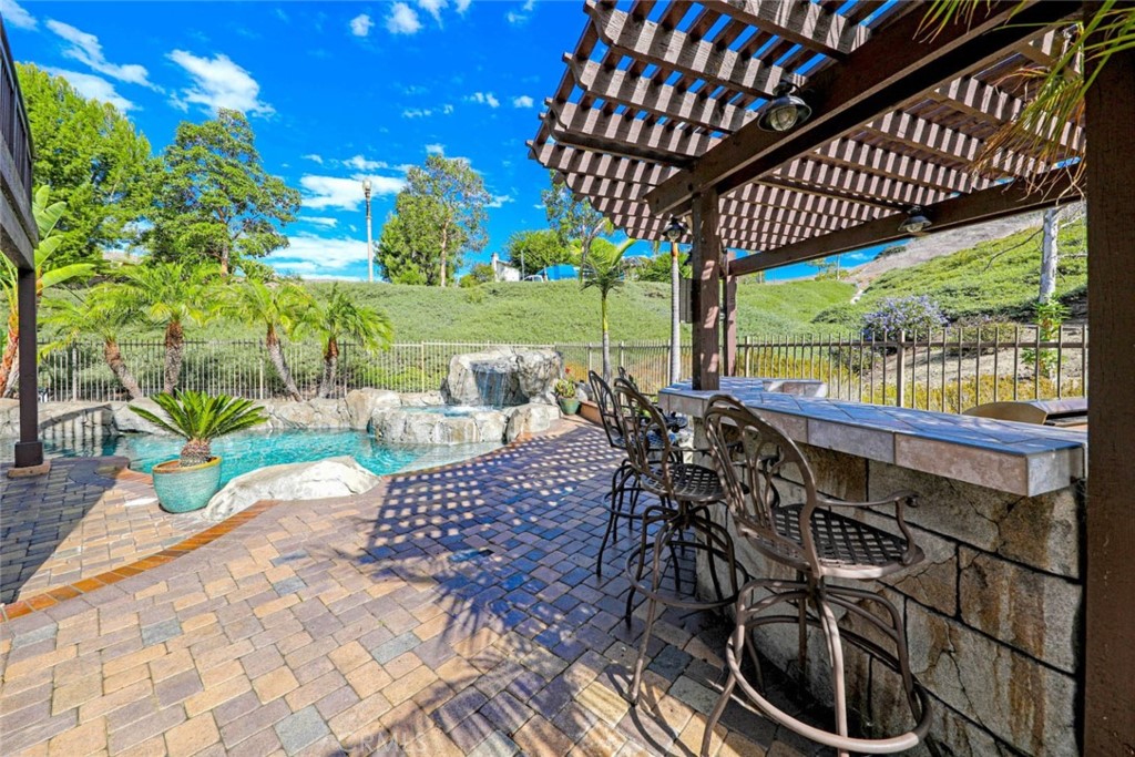 6402 Camino Ventosa San Clemente, CA 92673 - Photo 42 of 67 a view of a patio with a table chairs and backyard