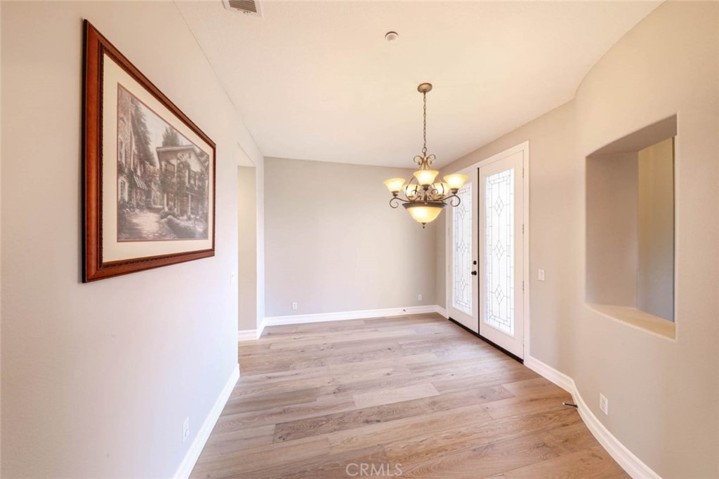 6402 Camino Ventosa San Clemente, CA 92673 - Photo 6 of 67 a view of a hallway with a chandelier