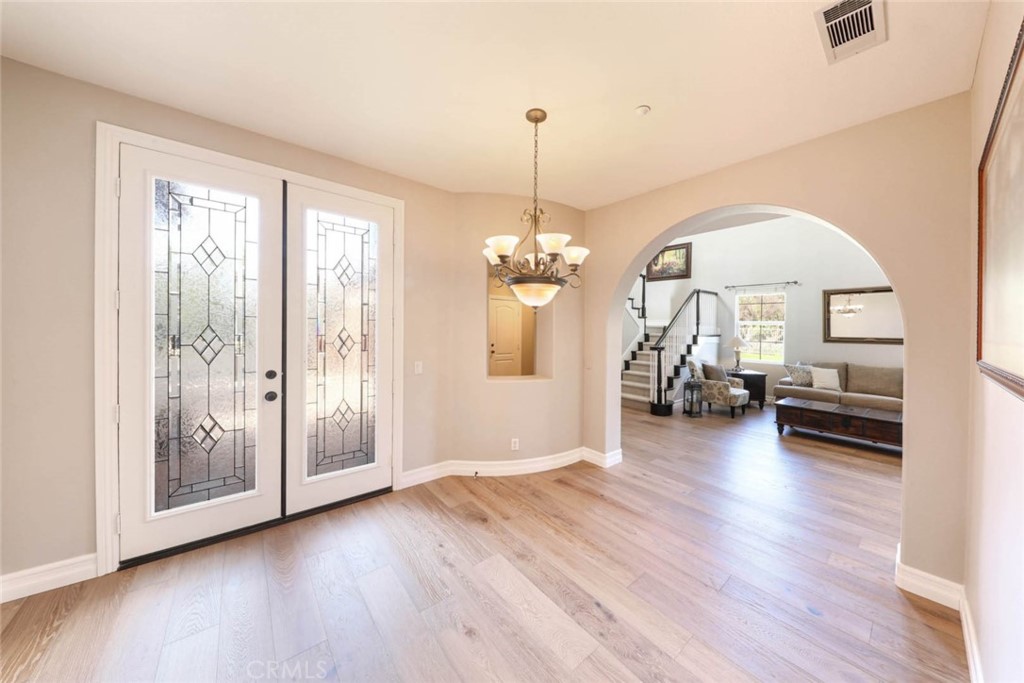 6402 Camino Ventosa San Clemente, CA 92673 - Photo 7 of 67 a view of a livingroom with hardwood floor and a ceiling fan
