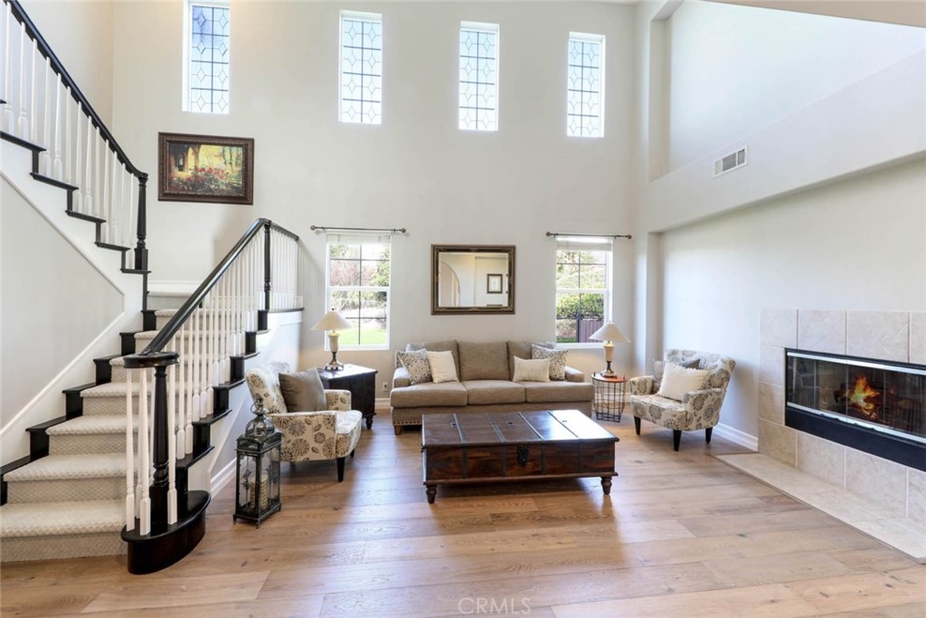 6402 Camino Ventosa San Clemente, CA 92673 - Photo 8 of 67 a living room with furniture large window and a fireplace