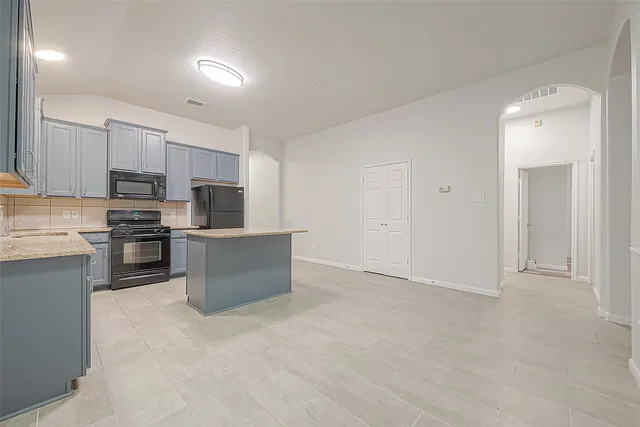 a large kitchen with cabinets
