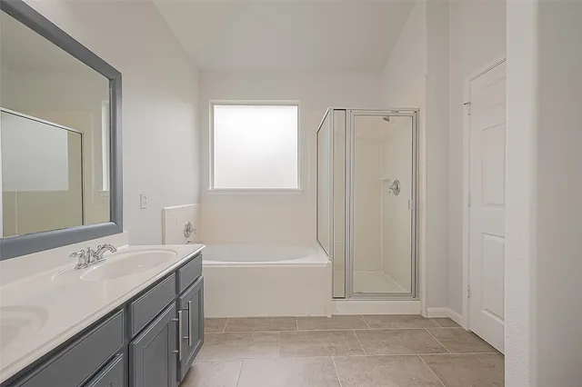 a bathroom with a bathtub and a sink