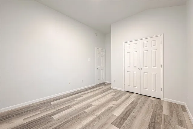a view of room with window and closet