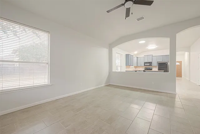 a view of a kitchen with furniture and window