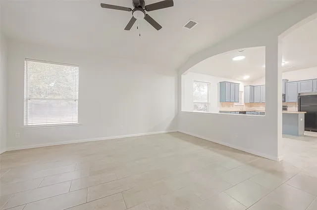 a view of an empty room with a window