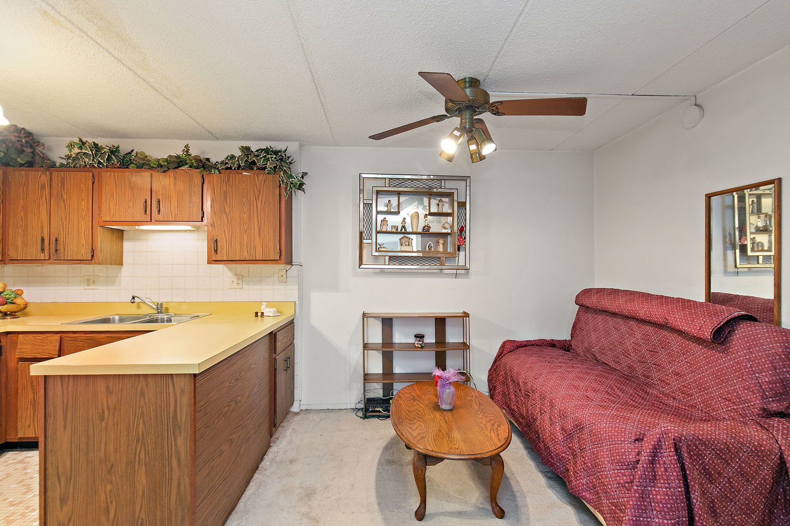 5s100 Pebblewood Lane, Unit E6 Naperville, IL 60563 - Photo 9 of 18 a kitchen with a sink a stove and chairs with wooden floor