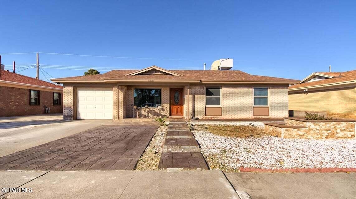 5629 Devon Avenue El Paso, TX 79924 - Photo 1 of 1 a front view of a house with a yard