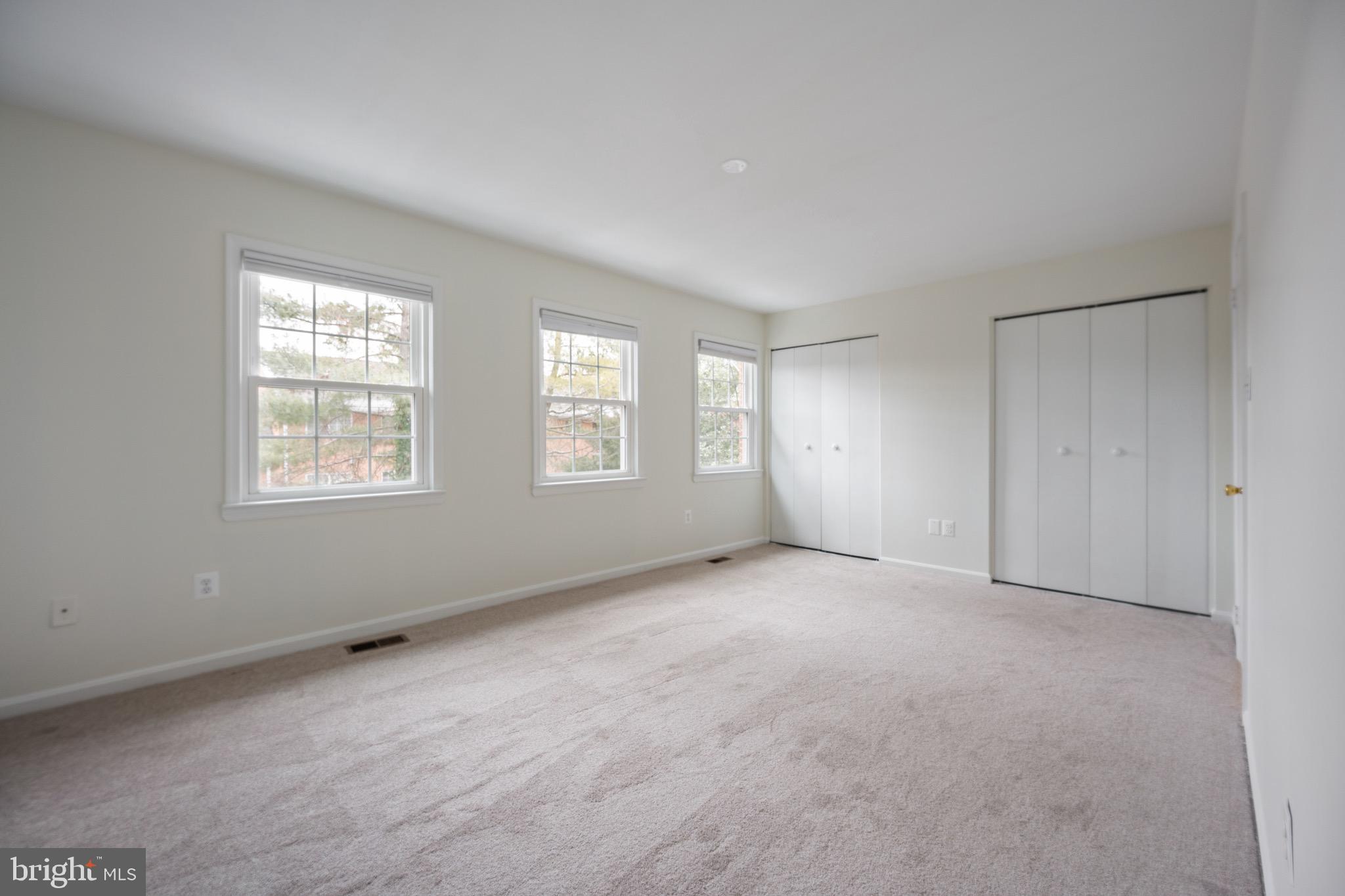 2436 Windbreak Drive Alexandria, VA 22306 - Photo 14 of 36 a view of an empty room with windows