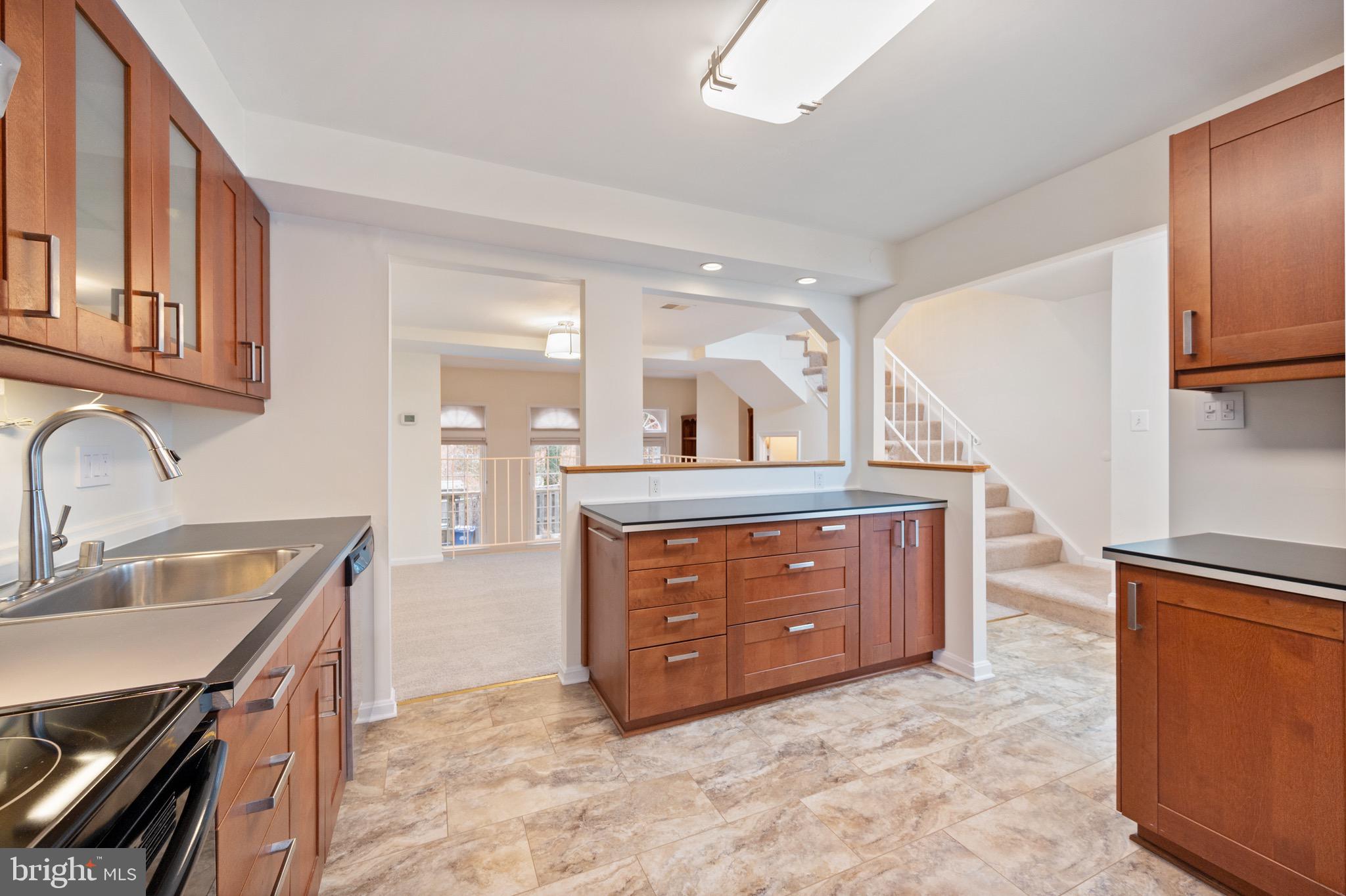 2436 Windbreak Drive Alexandria, VA 22306 - Photo 2 of 36 a spacious bathroom with a granite countertop sink and a mirror