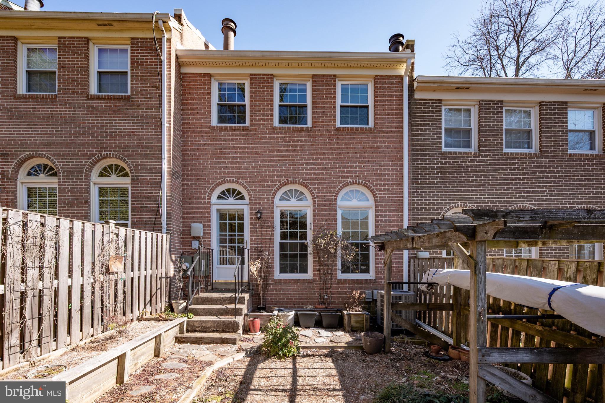 2436 Windbreak Drive Alexandria, VA 22306 - Photo 21 of 36 a front view of a house with a yard