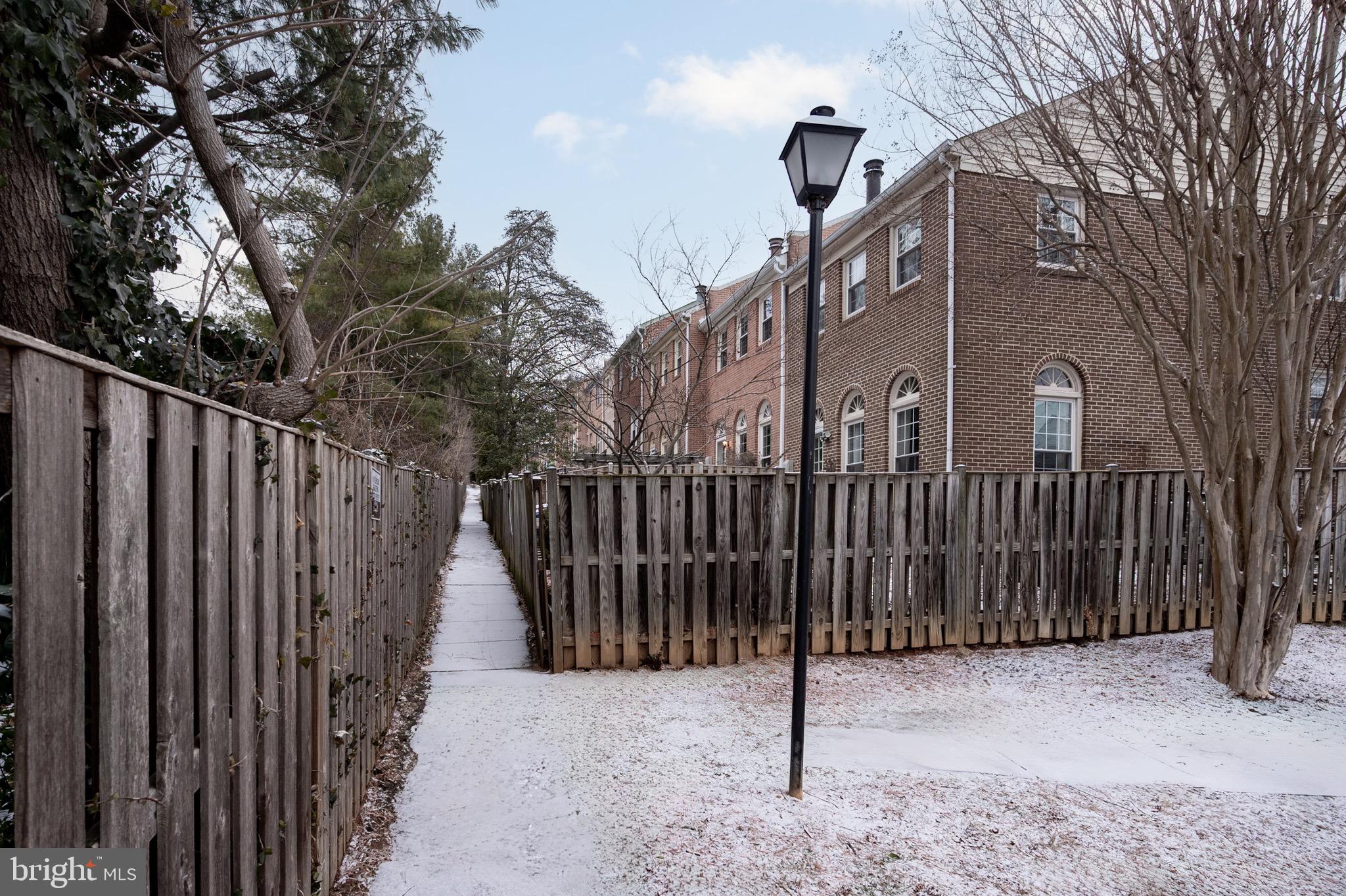 2436 Windbreak Drive Alexandria, VA 22306 - Photo 24 of 36 a view of a house with a wooden fence