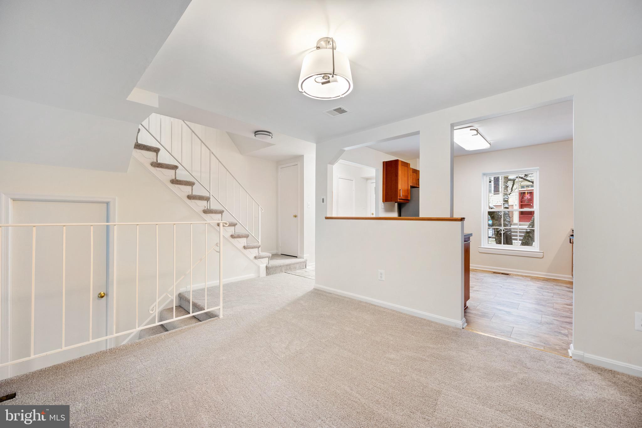 2436 Windbreak Drive Alexandria, VA 22306 - Photo 7 of 36 wooden floor in an empty room with a window
