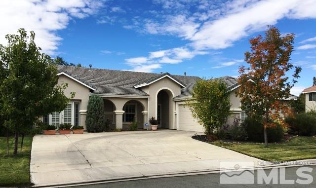 10403 Copper Wood Court Reno, NV 89521 - Photo 1 of 1 a view of a white house with a yard and large tree