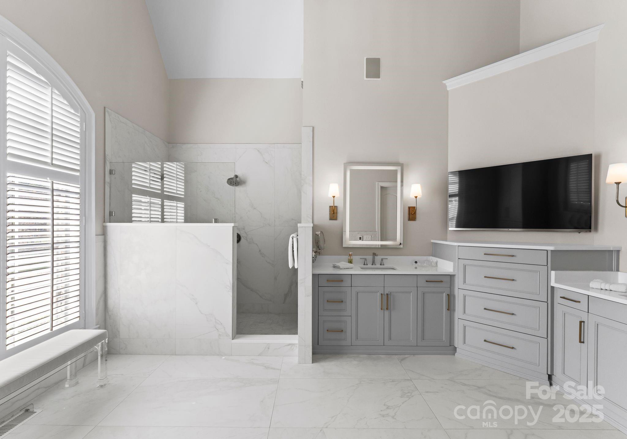 4004 Channel Point Lane Denver, NC 28037 - Photo 12 of 48 a living room with a flat screen tv a washer and dryer