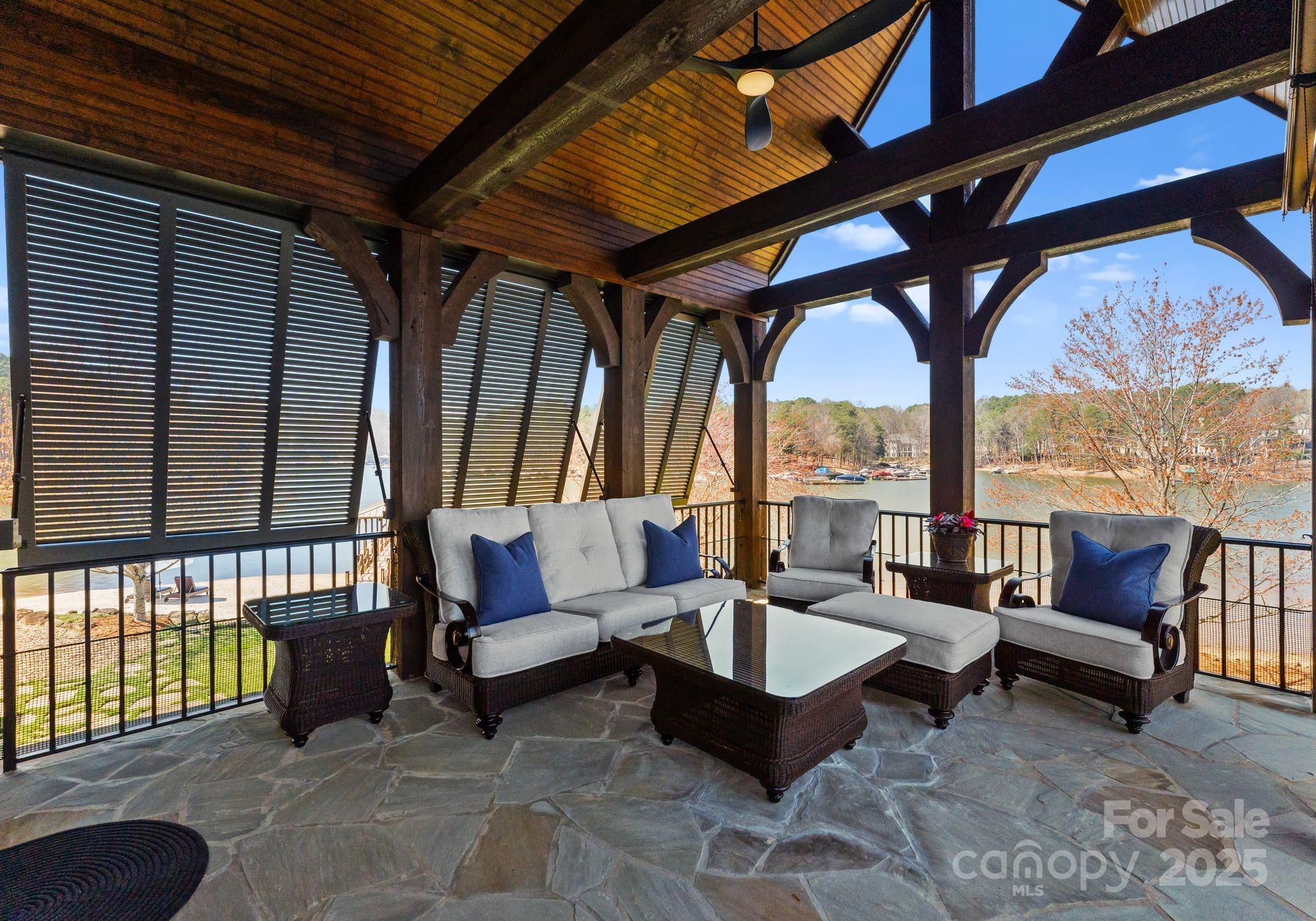 4004 Channel Point Lane Denver, NC 28037 - Photo 16 of 48 a outdoor space with patio couches and a fireplace