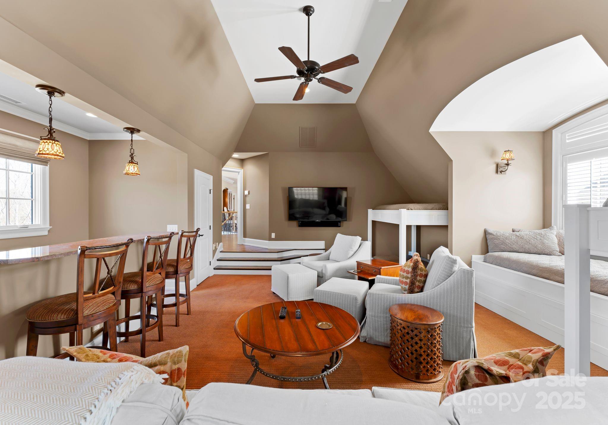 4004 Channel Point Lane Denver, NC 28037 - Photo 24 of 48 a living room with furniture kitchen view and a chandelier