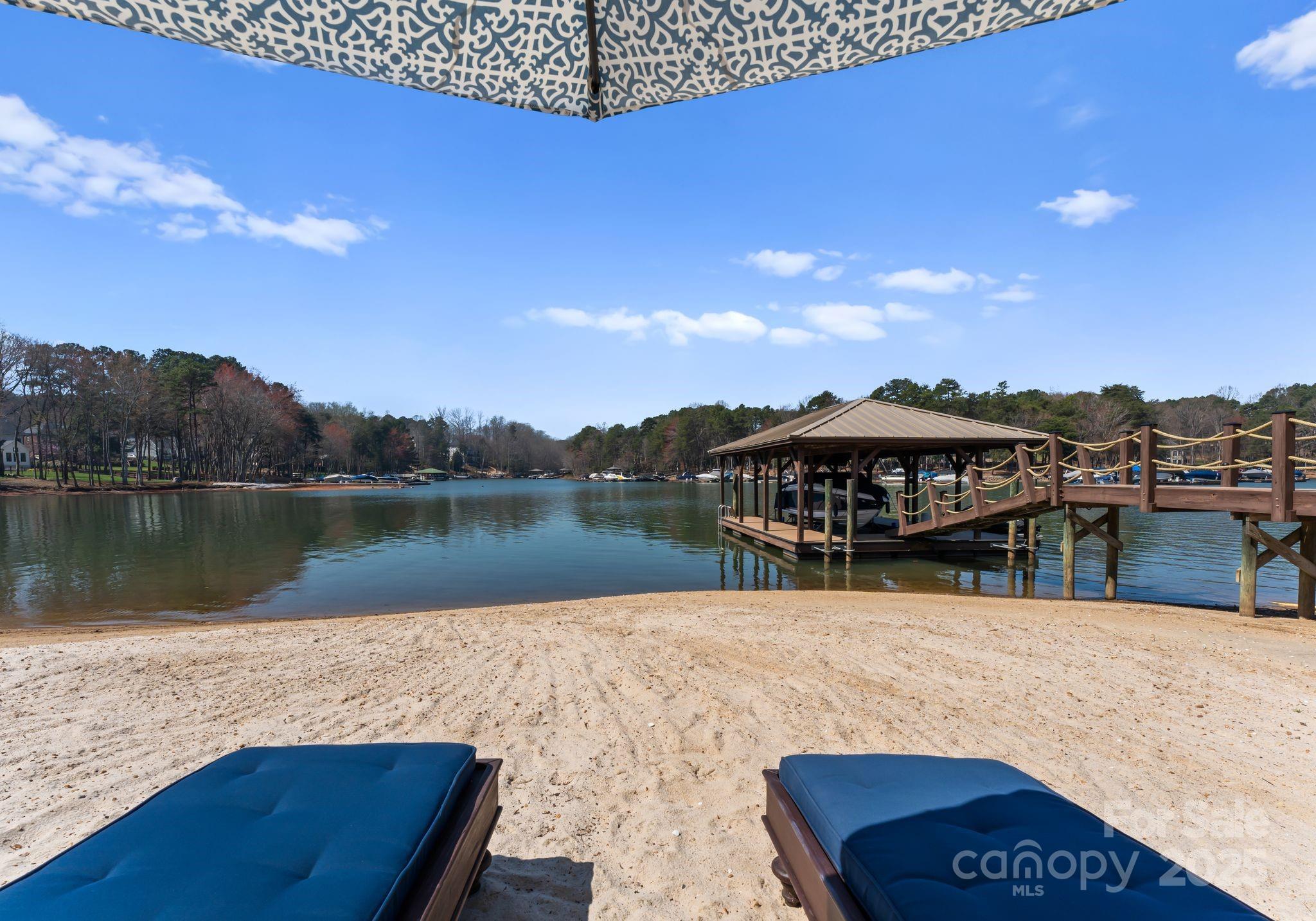 4004 Channel Point Lane Denver, NC 28037 - Photo 31 of 48 a view of a house with a lake view