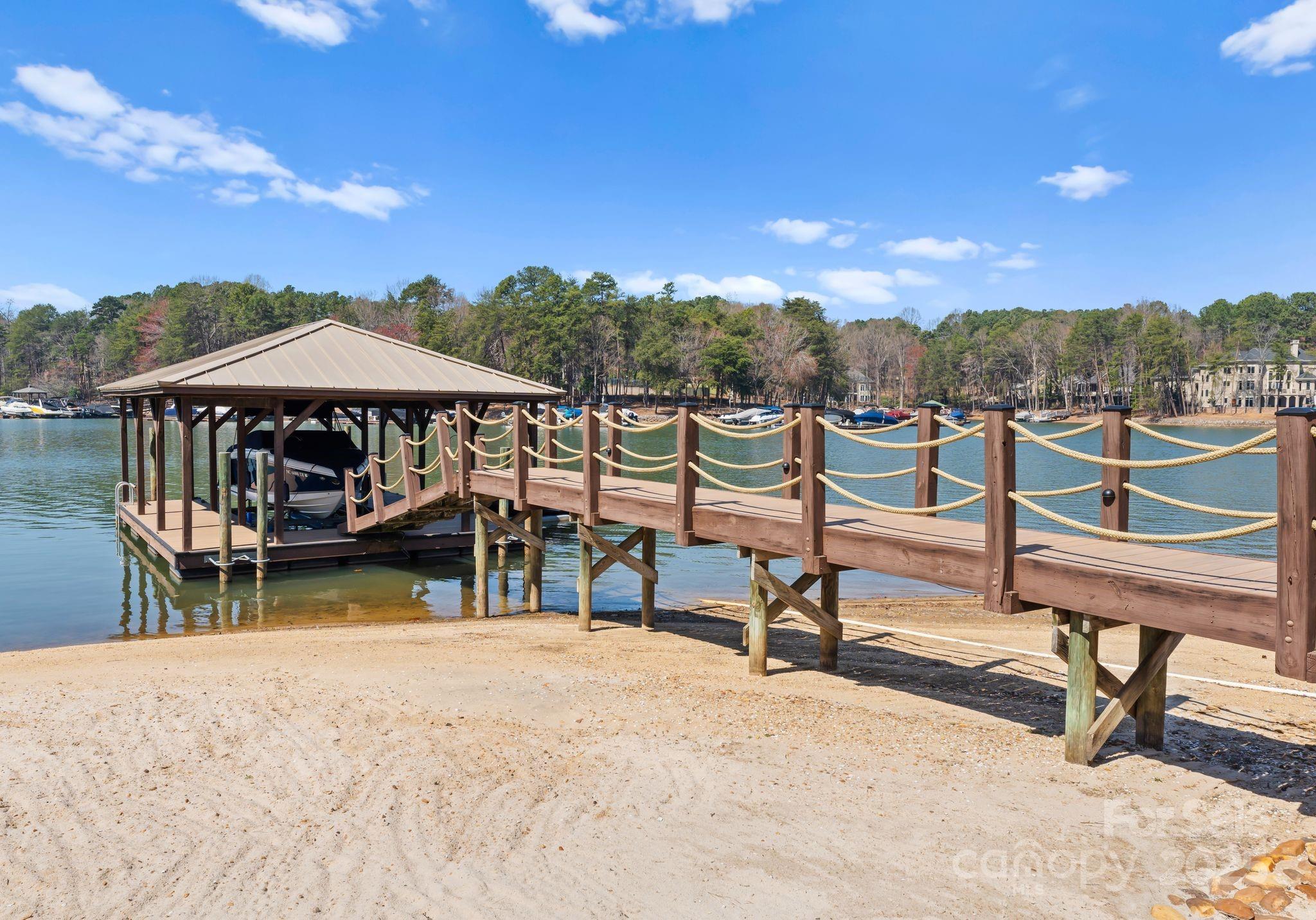 4004 Channel Point Lane Denver, NC 28037 - Photo 33 of 48 a view of a swimming pool with lounge chairs