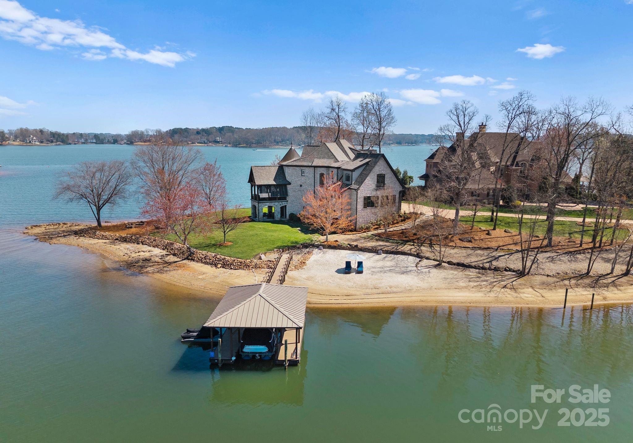 4004 Channel Point Lane Denver, NC 28037 - Photo 42 of 48 a view of a lake with a house in the background