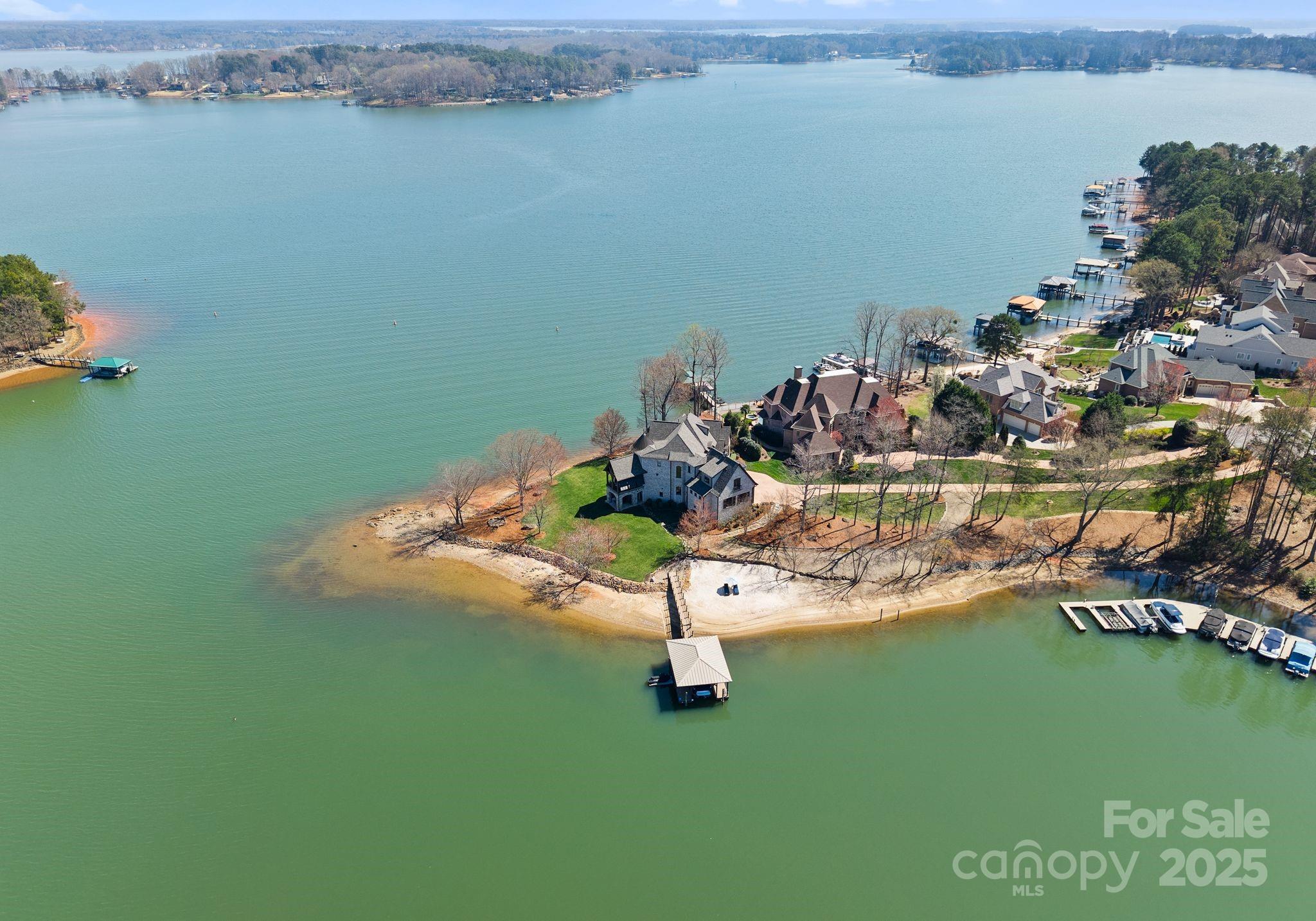 4004 Channel Point Lane Denver, NC 28037 - Photo 44 of 48 a view of a lake with lawn chairs