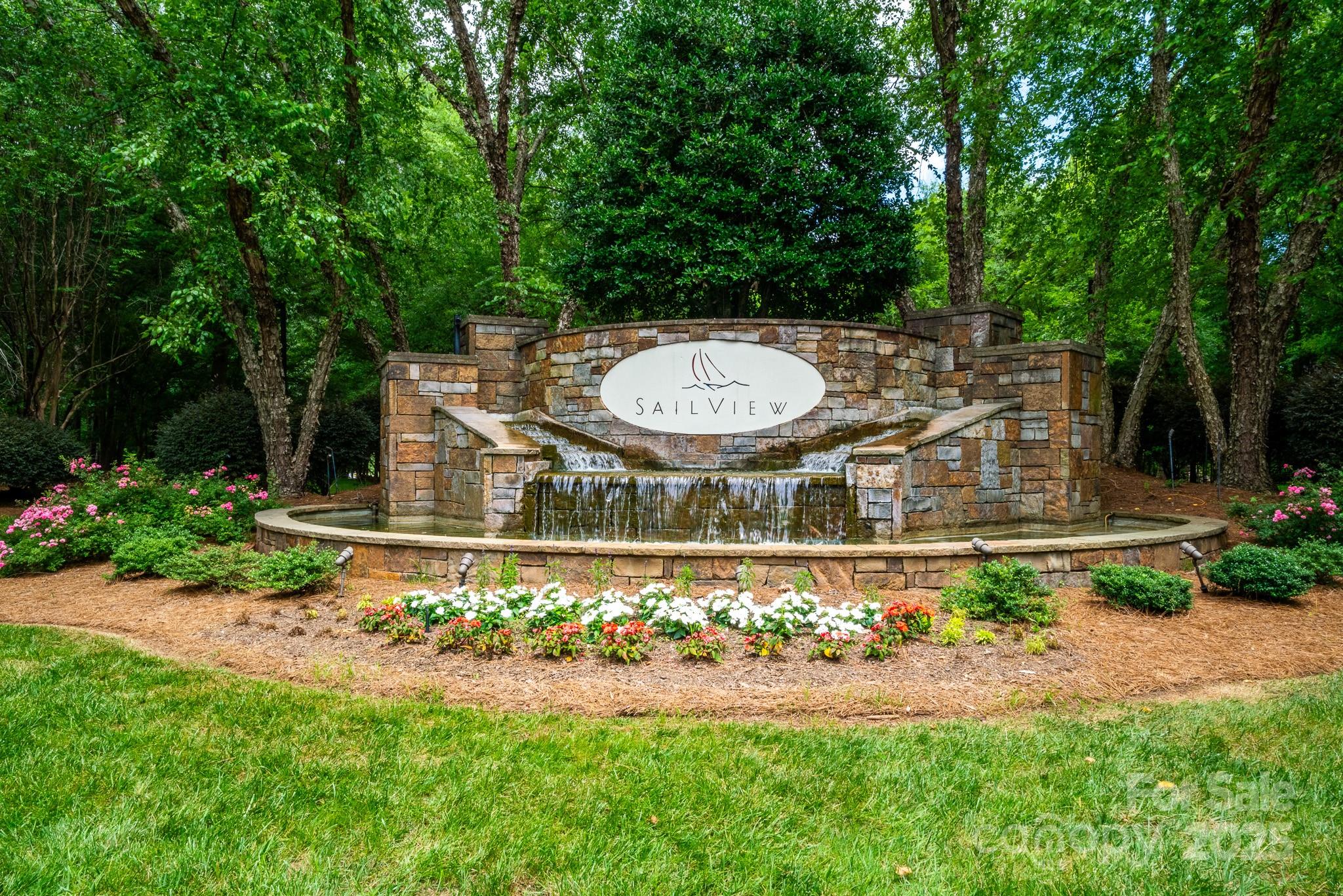 4004 Channel Point Lane Denver, NC 28037 - Photo 48 of 48 a view of a backyard with plants and garden