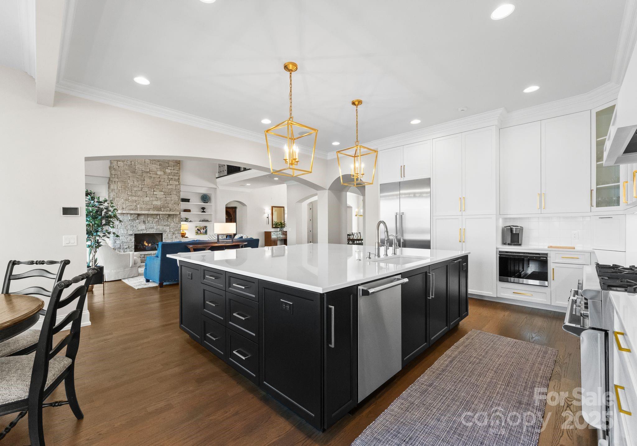 4004 Channel Point Lane Denver, NC 28037 - Photo 5 of 48 an open kitchen with stainless steel appliances granite countertop a stove and kitchen island