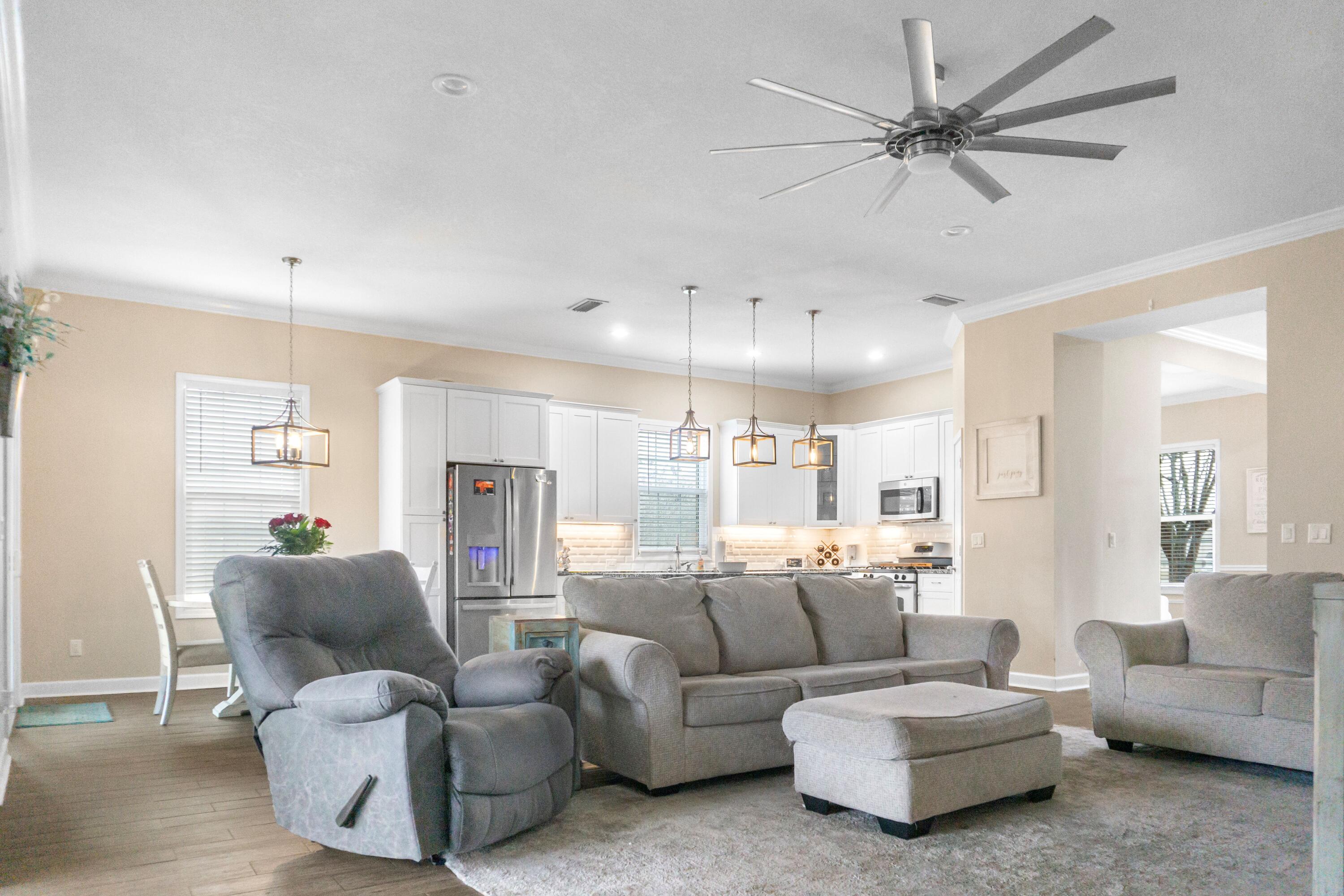 2902 Short Tail Court Panama City, FL 32405 - Photo 11 of 46 a living room with furniture and a large window