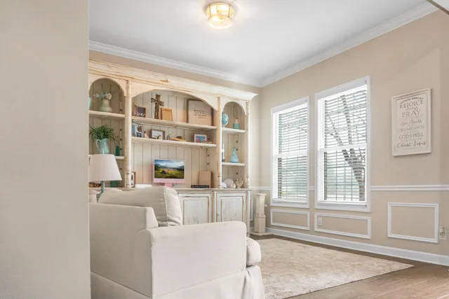 a living room with furniture and a window