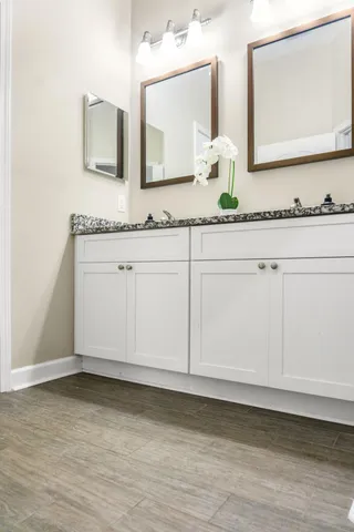 a white toilet sitting next to a bath tub