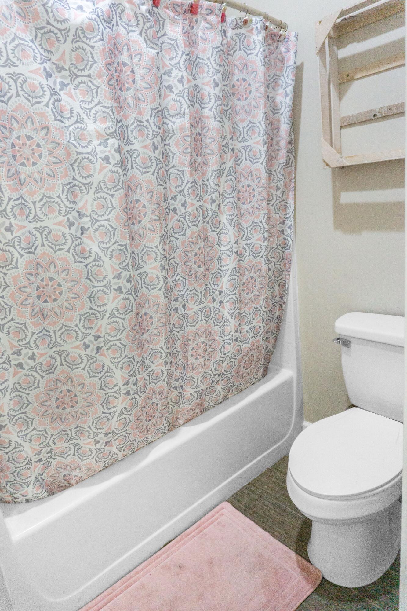 2902 Short Tail Court Panama City, FL 32405 - Photo 27 of 46 a white toilet sitting next to a bath tub