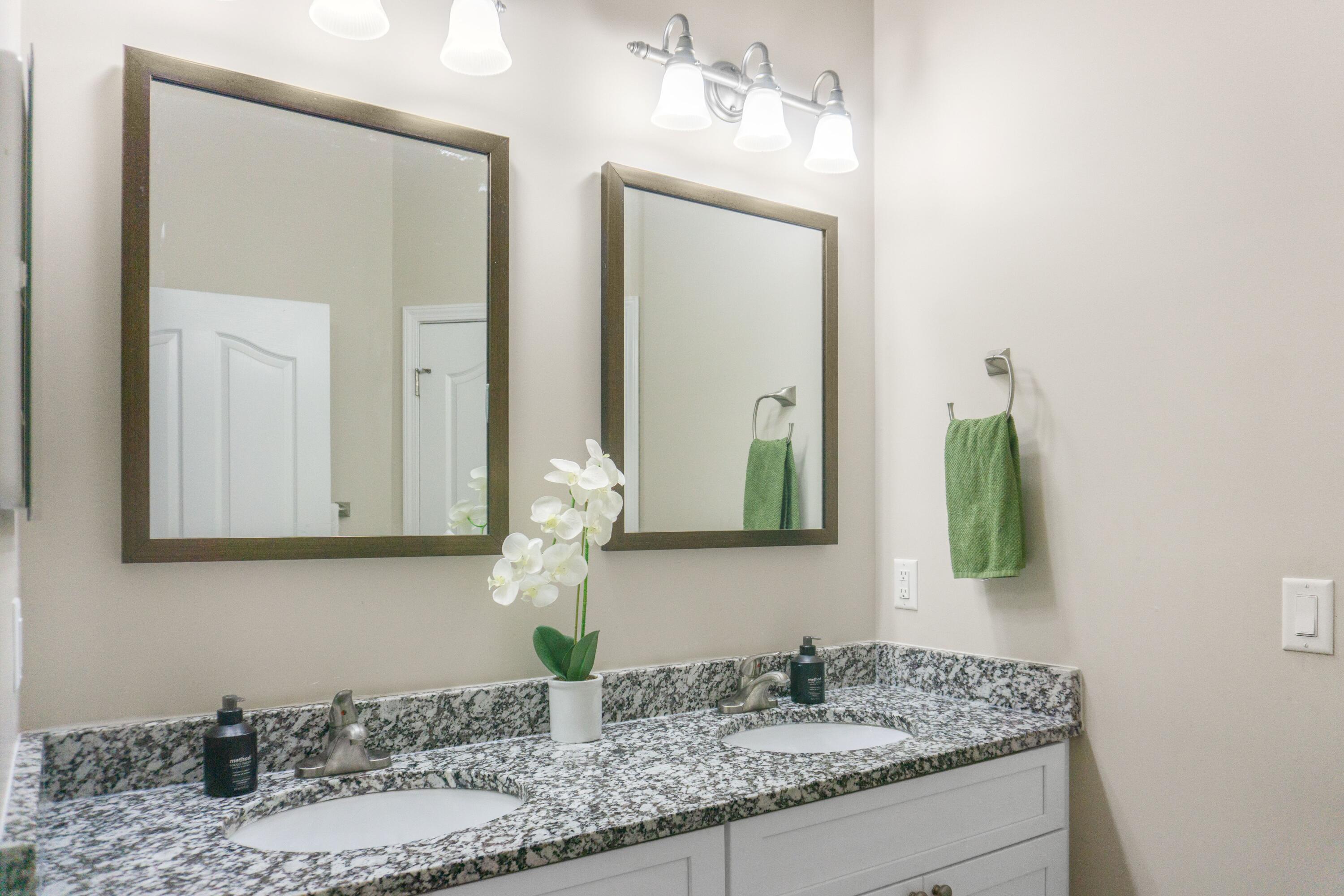 2902 Short Tail Court Panama City, FL 32405 - Photo 29 of 46 a bathroom with a granite countertop sink and a mirror