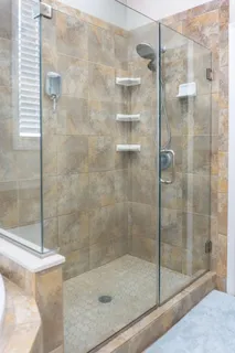 a white bath tub sitting in a bathroom