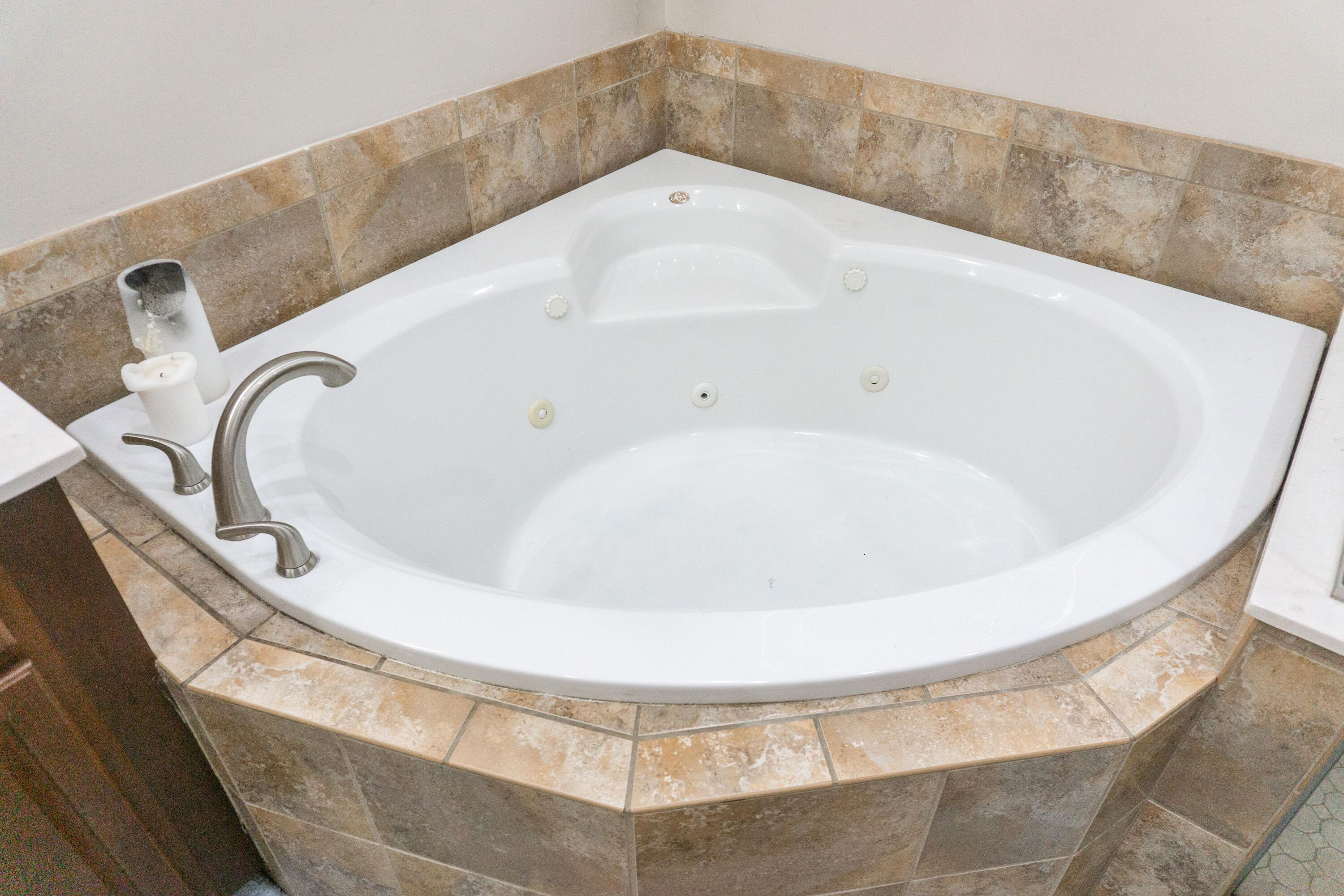 2902 Short Tail Court Panama City, FL 32405 - Photo 40 of 46 a white bath tub sitting in a bathroom