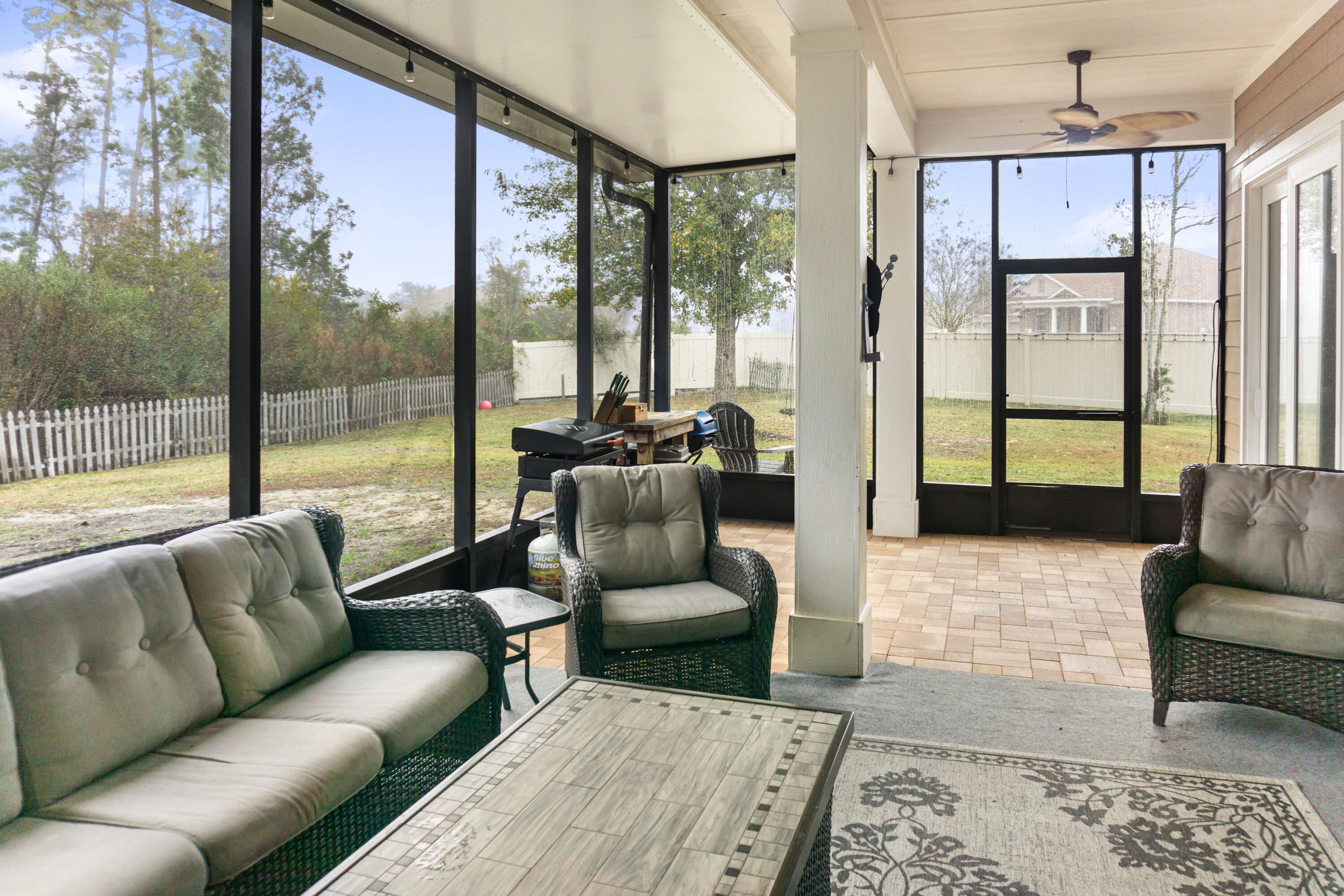 2902 Short Tail Court Panama City, FL 32405 - Photo 8 of 46 a living room with furniture and a large window